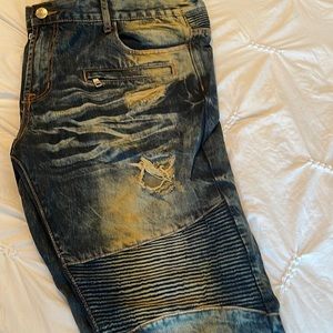 Embellish washed jeans with rips